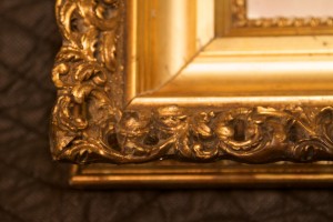 Antique frame after carving and gilding compound. 