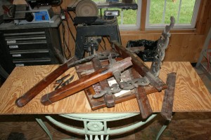 The table in pieces with broken carved aprons.